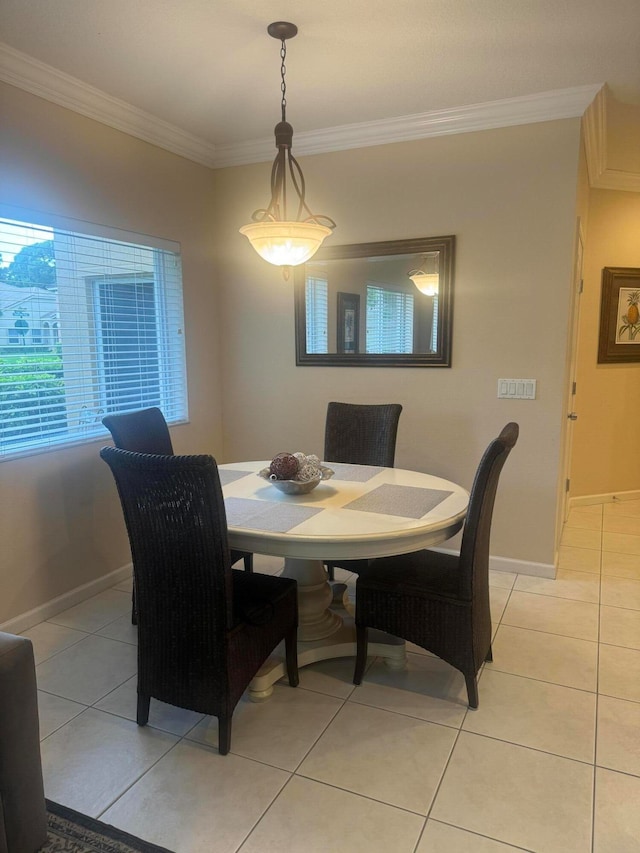 dining room featuring ornamental molding and light tile patterned floors