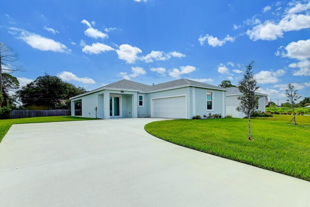 1749 SW California Blvd, Port Saint Lucie, FL 34953 - view of front facade featuring stucco siding, a garage, and driveway