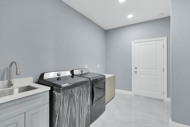 1749 SW California Blvd, Port Saint Lucie, FL 34953 - laundry area featuring separate washer and dryer, a sink, light marble finish floors, baseboards, and recessed lighting