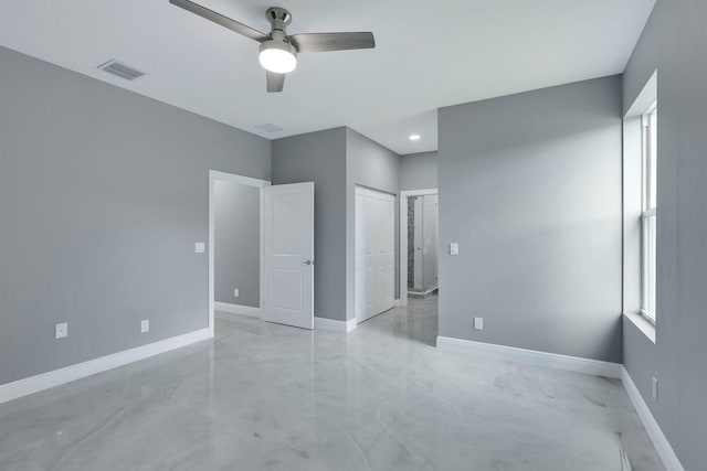 unfurnished bedroom featuring ceiling fan