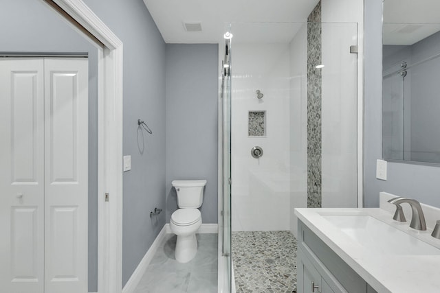 bathroom featuring walk in shower, vanity, and toilet