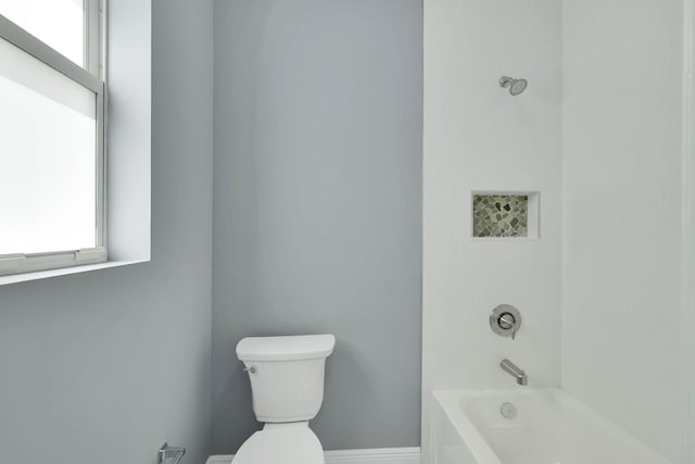 1749 SW California Blvd, Port Saint Lucie, FL 34953 - full bath with plenty of natural light, toilet, bathing tub / shower combination, and baseboards
