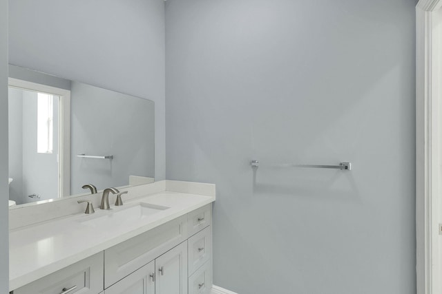 1749 SW California Blvd, Port Saint Lucie, FL 34953 - bathroom with vanity, toilet, and baseboards