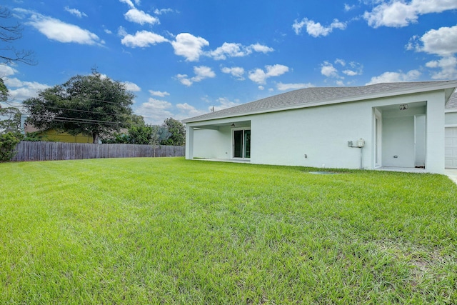 1749 SW California Blvd, Port Saint Lucie, FL 34953 - back of house featuring stucco siding and a garage