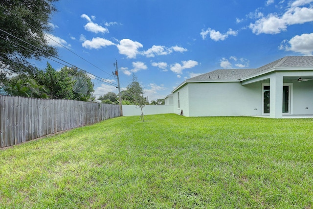 view of yard with ceiling fan