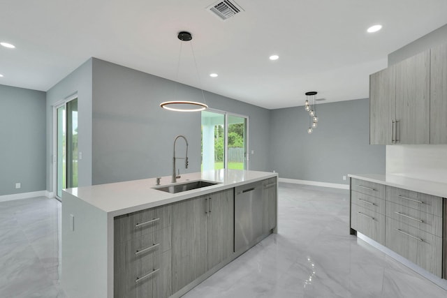 kitchen with stainless steel dishwasher, a center island with sink, decorative light fixtures, and sink