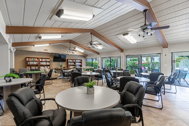 tiled dining room featuring a healthy amount of sunlight, lofted ceiling with beams, and ceiling fan