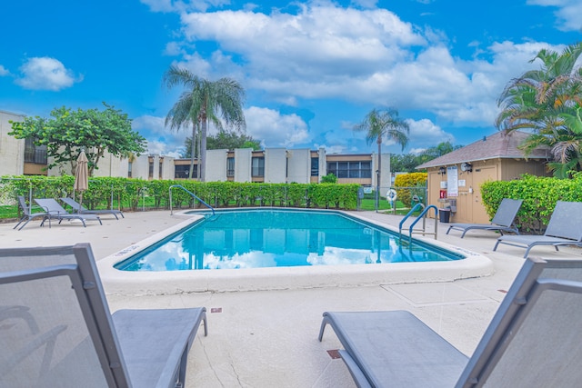 view of swimming pool with a patio area