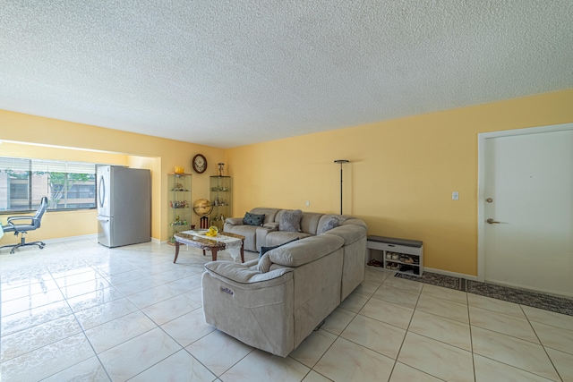 tiled living room with a textured ceiling