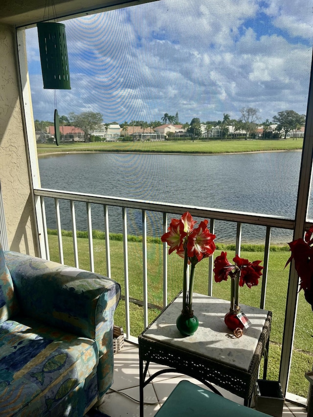 balcony featuring a water view