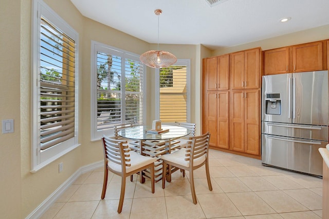 dining area with light tile patterned flooring