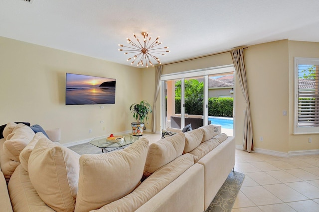 living room with a notable chandelier and light tile patterned floors