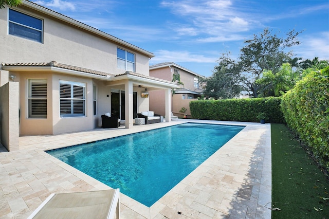 view of swimming pool featuring a patio area