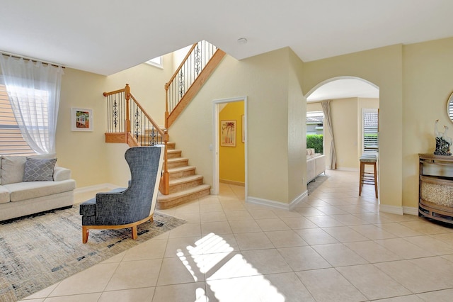 tiled foyer entrance featuring a wealth of natural light