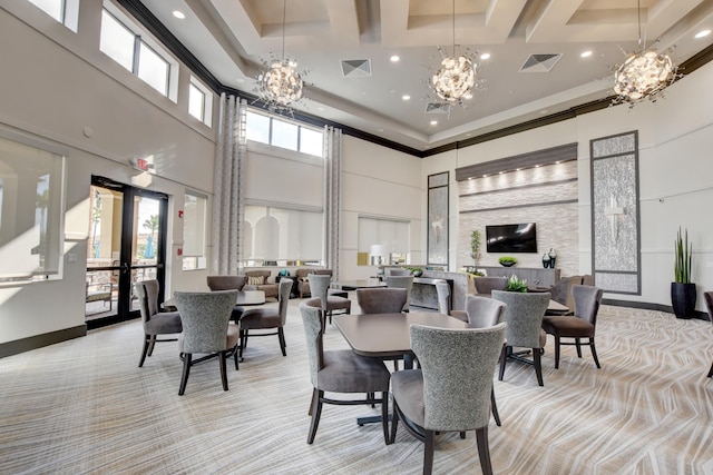 carpeted dining area featuring an inviting chandelier, a towering ceiling, and coffered ceiling