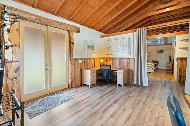 office space with lofted ceiling with beams, light wood-type flooring, wood ceiling, wood walls, and french doors