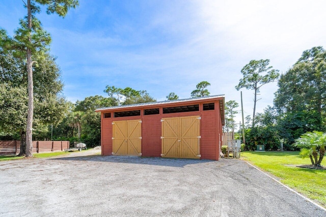 garage with a yard