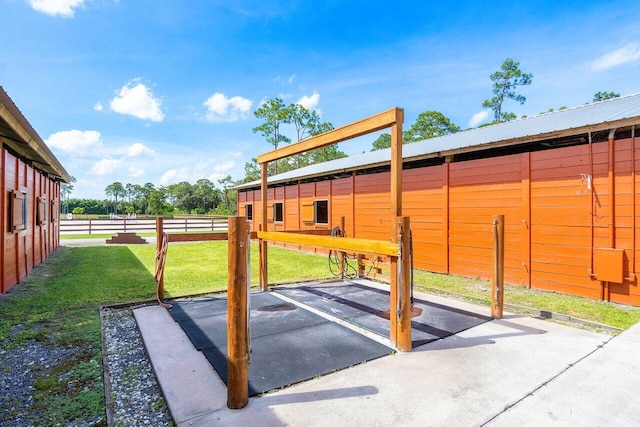 view of patio with an outbuilding