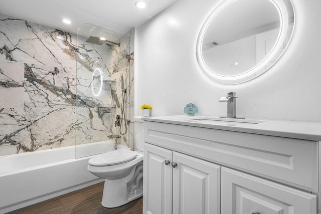 full bathroom with vanity, toilet, shower / bath combination, and wood-type flooring