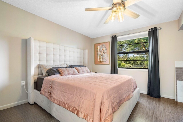 bedroom featuring ceiling fan and wood-type flooring