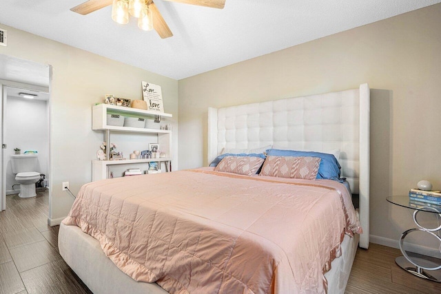 bedroom with ensuite bath, ceiling fan, and wood-type flooring