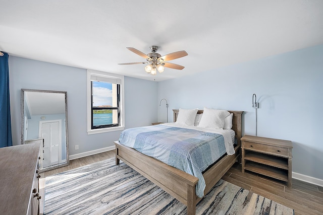 bedroom featuring ceiling fan and dark hardwood / wood-style flooring