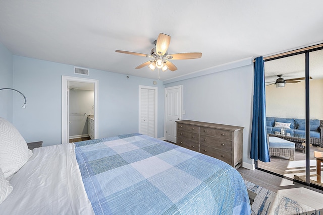 bedroom with ceiling fan and wood-type flooring