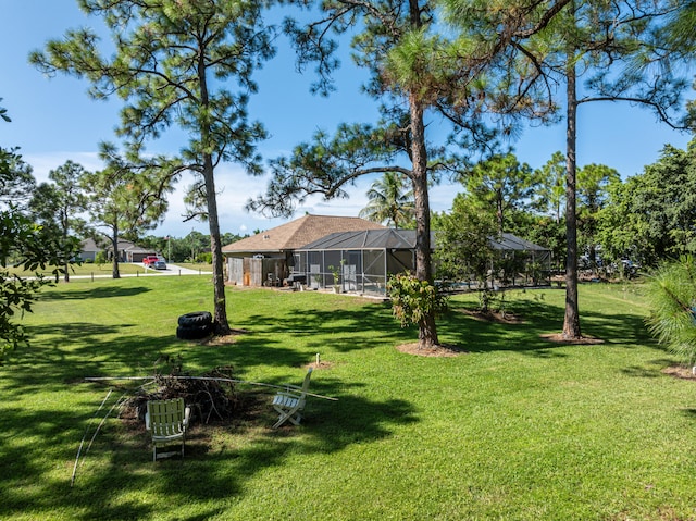 view of yard with a lanai