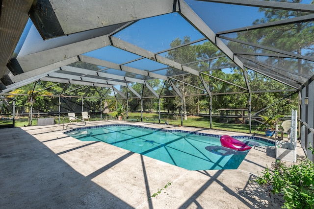 view of pool with a lanai and a patio area