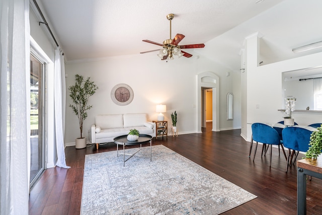 sitting room featuring ceiling fan, ornamental molding, vaulted ceiling, and dark hardwood / wood-style flooring