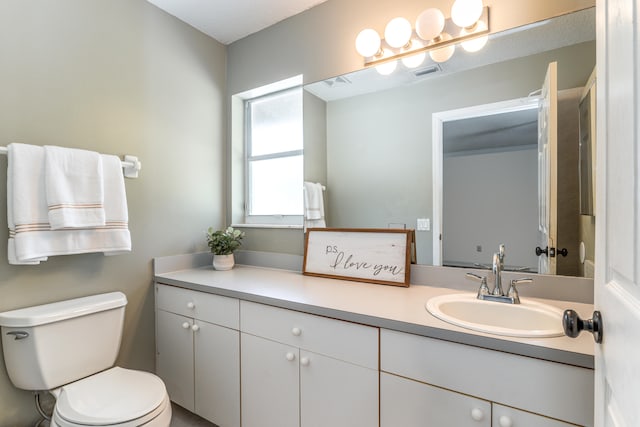 bathroom with vanity and toilet