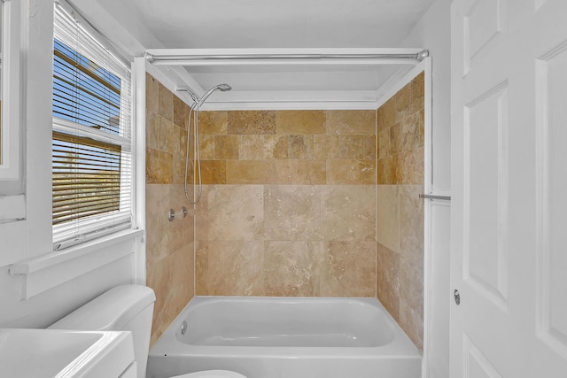 full bathroom with vanity, toilet, and tiled shower / bath