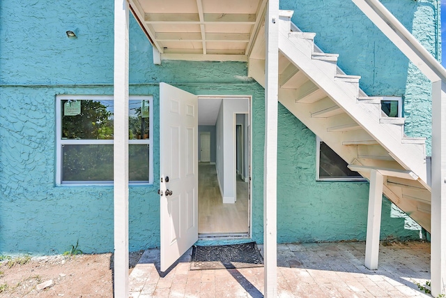 doorway to property featuring a patio area