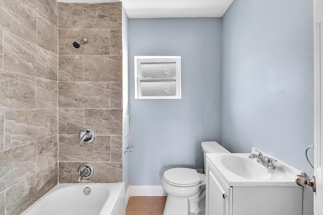 full bathroom featuring vanity, toilet, and tiled shower / bath combo