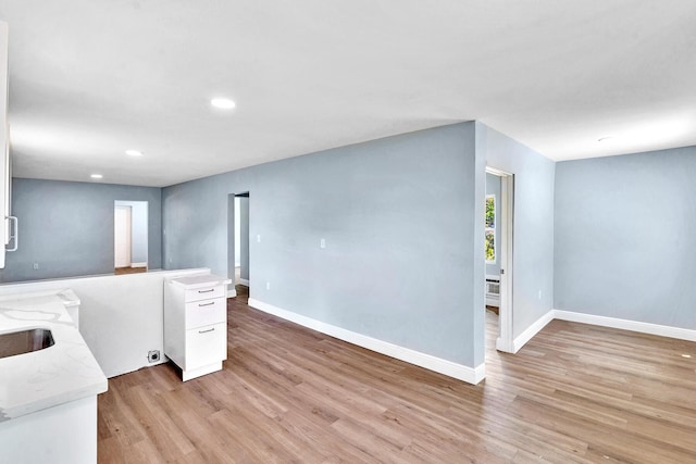 interior space with sink and light hardwood / wood-style floors