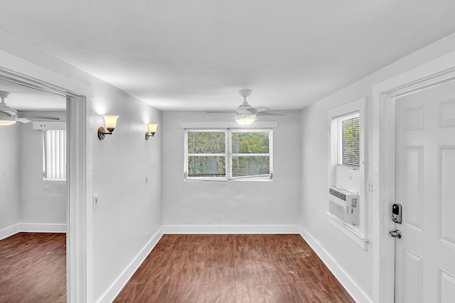 empty room with ceiling fan, cooling unit, and dark hardwood / wood-style flooring