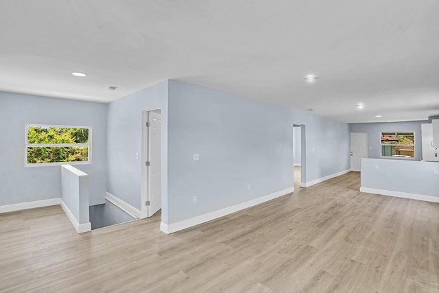 spare room with light wood-type flooring