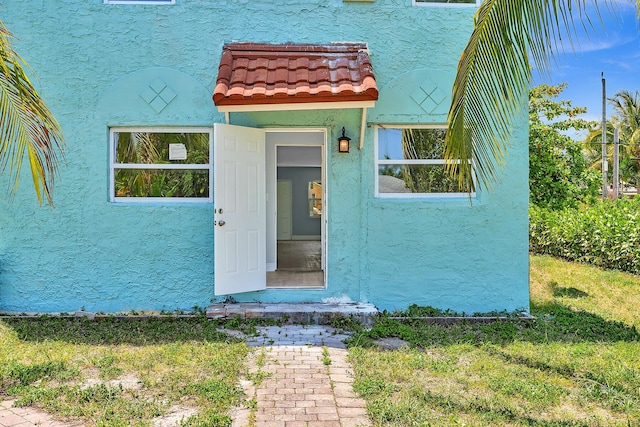 entrance to property with a yard