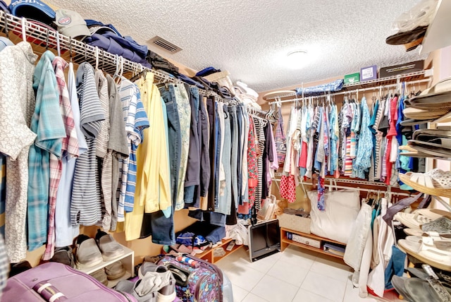 walk in closet featuring light tile patterned floors