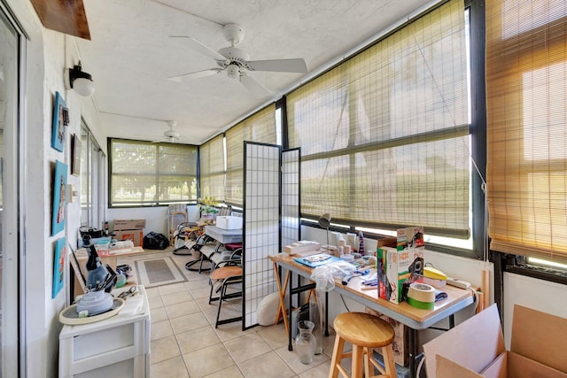 sunroom with ceiling fan and plenty of natural light