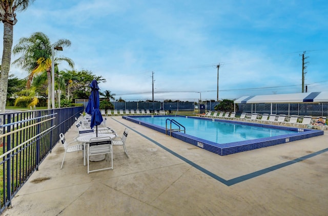 view of pool featuring a patio