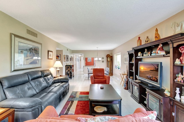 tiled living room with a textured ceiling