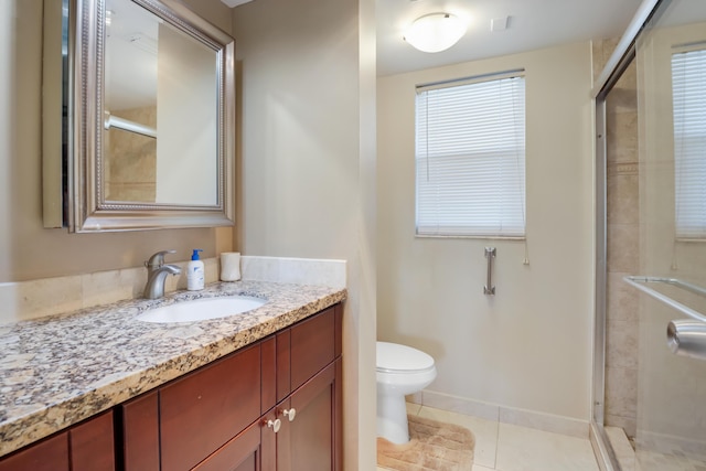 full bathroom with a shower stall, toilet, vanity, and tile patterned flooring