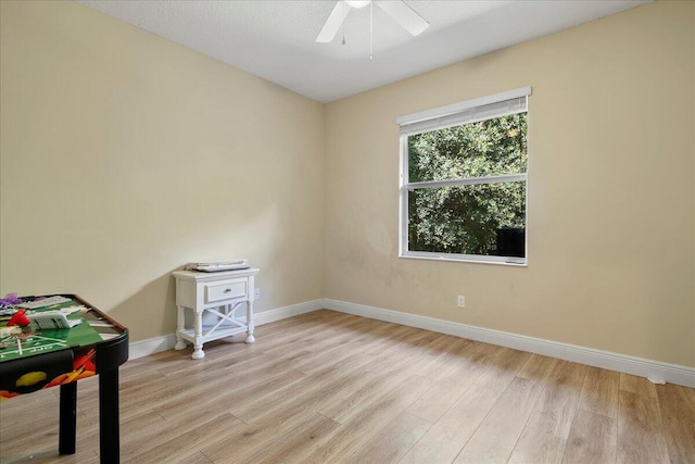 interior space featuring light wood-type flooring and ceiling fan