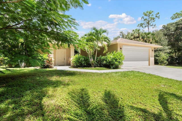 view of front of home with a garage and a front yard