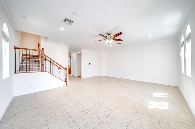 empty room with crown molding, ceiling fan, and light tile patterned floors