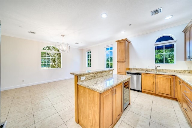 kitchen with sink, crown molding, decorative light fixtures, a center island, and dishwasher