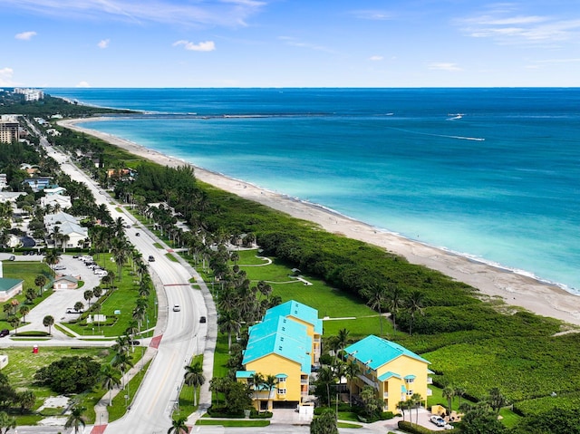 aerial view with a water view and a view of the beach