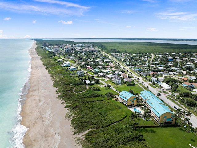 aerial view featuring a water view and a beach view