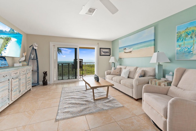 living room featuring ceiling fan and light tile patterned flooring